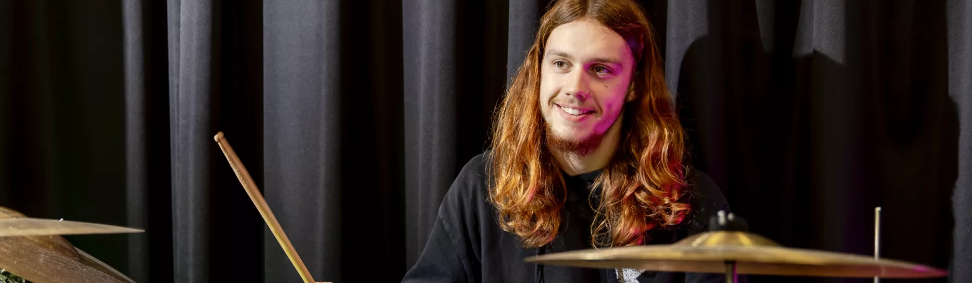 Male student playing drums